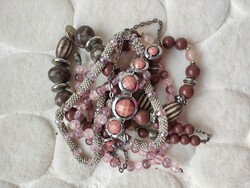 Silver-colored, pink-coral beige and brown-hued jewelry package