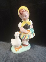 Marked, little girl with a goose ceramic