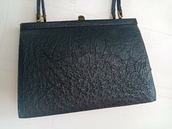 Elegant black women's leather bag with several compartments inside