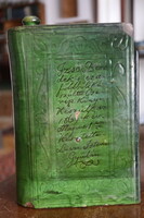 Green glazed brandy bottle in the shape of a book of poems field tour 1860