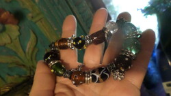 Bracelet made of Murano glass beads and metal fittings, strung on a rubber band.