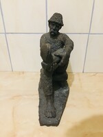 Large ceramic statue of a resting shepherd