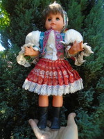 Beautiful, old, antique charming baby girl doll in original folk clothing