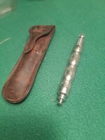 Old folding knife in original leather case