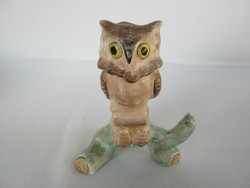 Craftsman owl sitting on a ceramic tree branch