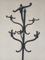 Antique Art Nouveau cast iron hanger. Negotiable.