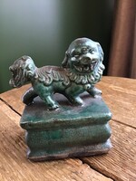 Cracked glazed ceramic foo dog statue