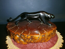 Glass jaguar on a wooden base