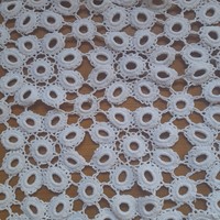 A large crochet tablecloth rich in details + lots of smaller ones in one