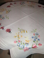 Beautiful cross-stitched hand-embroidered spring floral tablecloth