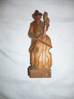 Carved wooden statue double bass figure
