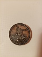 Commemorative coin by way of a milestone