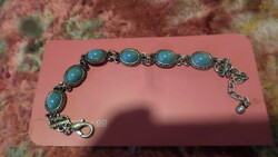 21 cm bracelet with chain, I think it is silver-plated.