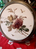 A huge earthenware tray with a metal frame