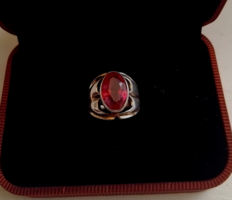 Old marked silver ring with Russian hallmark, set with a large cut ruby-colored stone