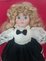 Doll with blonde porcelain head, combable