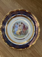 A beautiful scene richly gilded decorative plate.