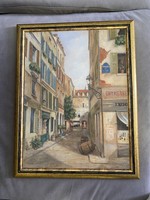 A framed table picture purchased from a gallery in the theme of a town in Provence