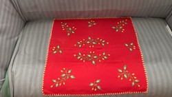 Hand-embroidered, acorn-patterned, red tablecloth