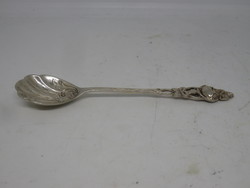 Silver spoon with rose-decorated handle