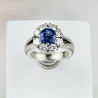 Gold ring with diamonds and sapphires. Accompanying ring