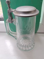 E b j engraved glass jug with metal lid.