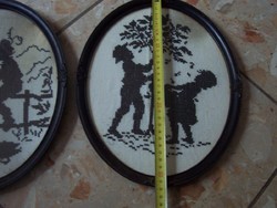 A pair of oval antique frames with goblet pictures inside