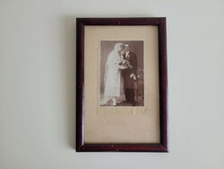Old wedding photo in photo frame with photo frame