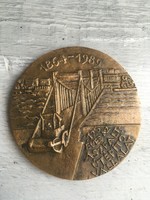 The asphalt road construction company is 125 years old, bronze commemorative plaque