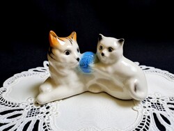 Cat mom playing with yarn figurine