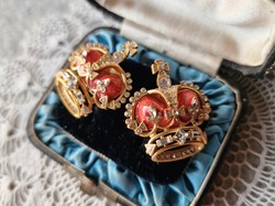 The gold tone enamel queen's crown earstud
