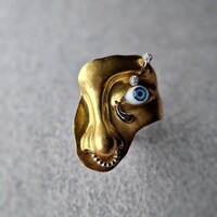 Runway style huge golden color mask shape ring
