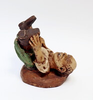 Könyvtámasz, groteszk figura