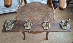 Beautiful large antique copper coat hanger, hanging on a wooden stand