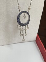 18-karat gold 0.74 Ct with diamonds and sapphires. With certificate.