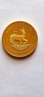 KRUGERRAND,  arany színű érme másolata.
