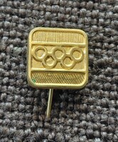 OLYMPIA   . Jelvény  , kitüző .