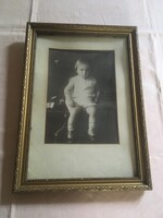 Old large black and white child photo in gold frame