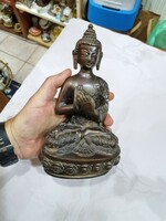 Eastern copper Buddha figure