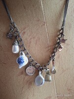 Jewelry necklace with porcelain and metal pendants