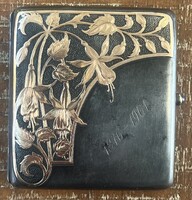 Gold steel cigarette case.