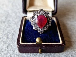925 sterling silver lace ring fully set with diamonds and rubies in a heart shape.