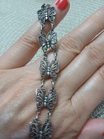 Pillangó formájú szemekből álló ezüst karlánc