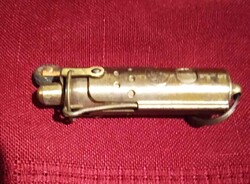 Old brass lighter that works and is 6 1/2  inches long