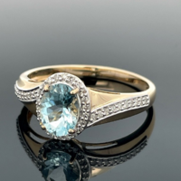Gold ring with diamonds and aquamarine