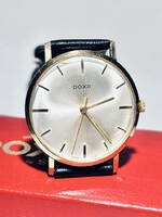 14 karátos arany doxa jelölt gyári tokjában, gyári dobozával! Meseszép állapot 34 mm k.n. Új Hirsch