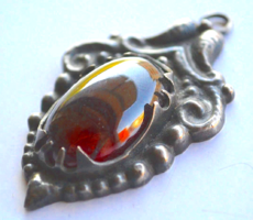Silver pendant with red stone
