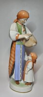 Zsolnay woman with bread knife