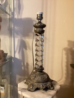 Screwed glass column lamp with embossed metal base.