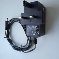 Angol dugvillás NETGEAR  AC-DC adapter , 12 V , 1 A ., 5 mm.-s  dugó , használt .